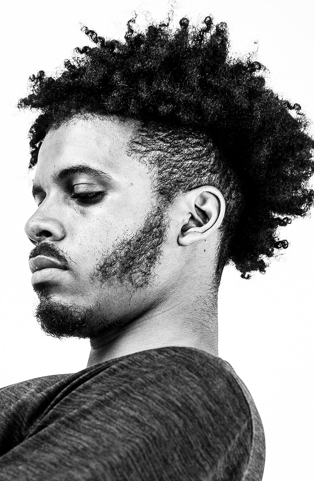 side profile of man with tapered afro hairstyle