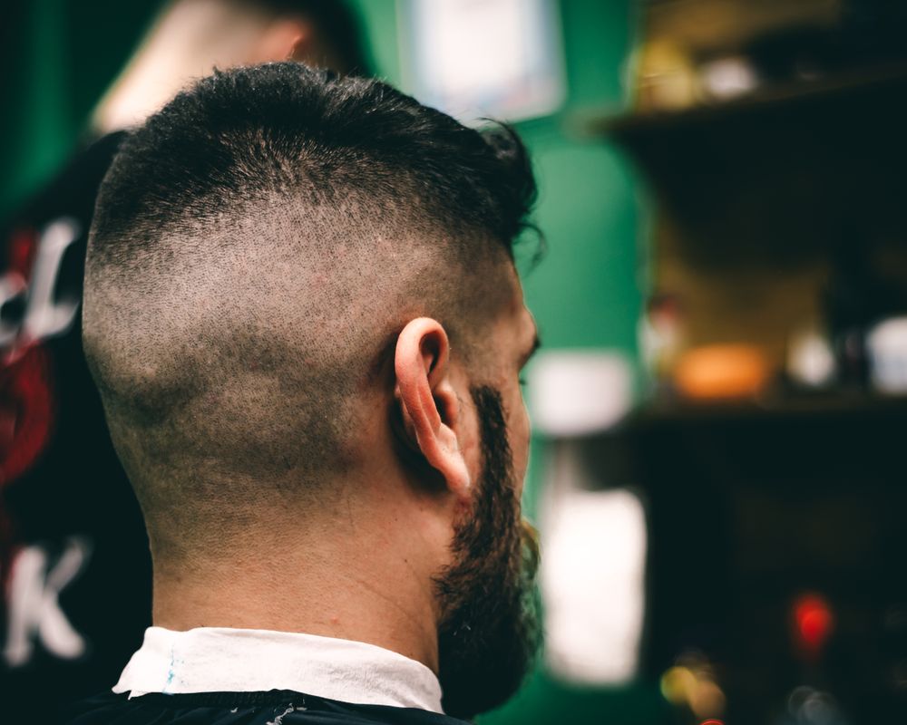 back view of man with clean low fade haircut