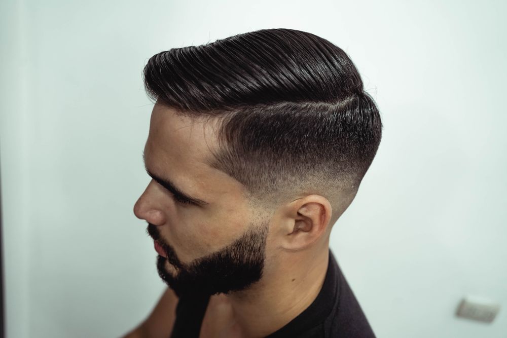 man in barbershop with short cropped haircut