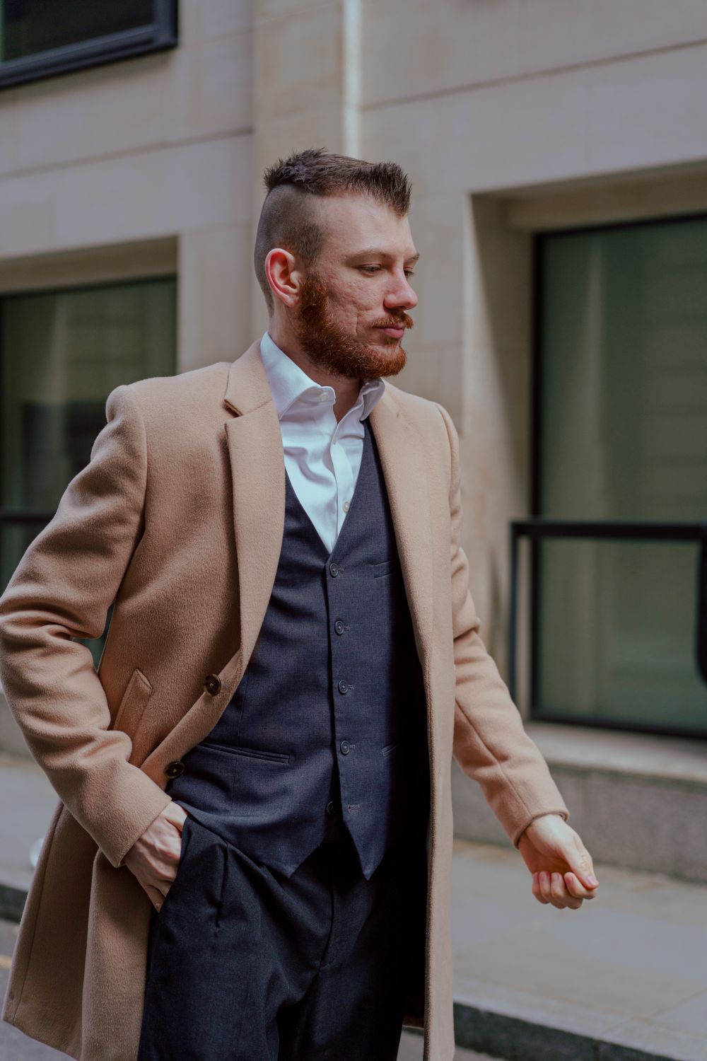 bearded man with short tapered hairstyle in business attire