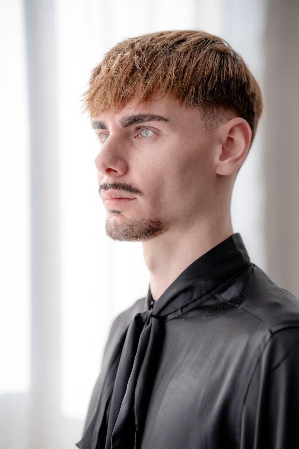 young man with short textured fringe and neat tapered sides