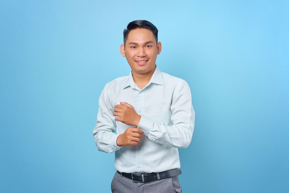 man with a clean short side part hairstyle in business attire