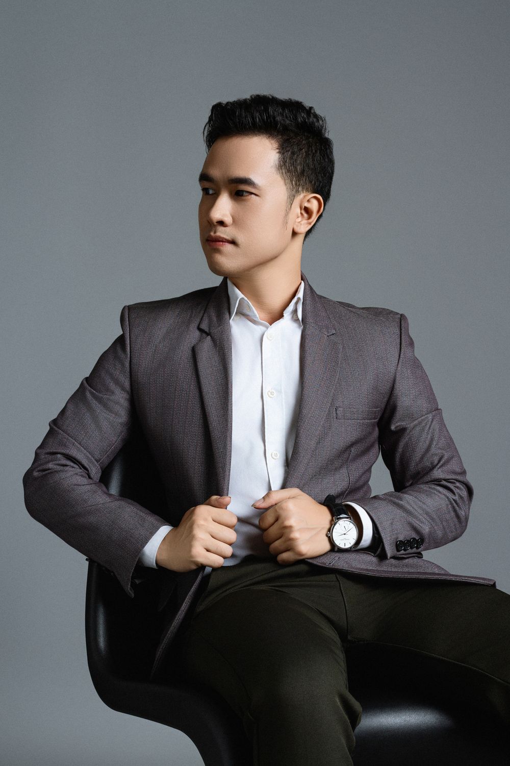 man in a suit with a short polished taper haircut