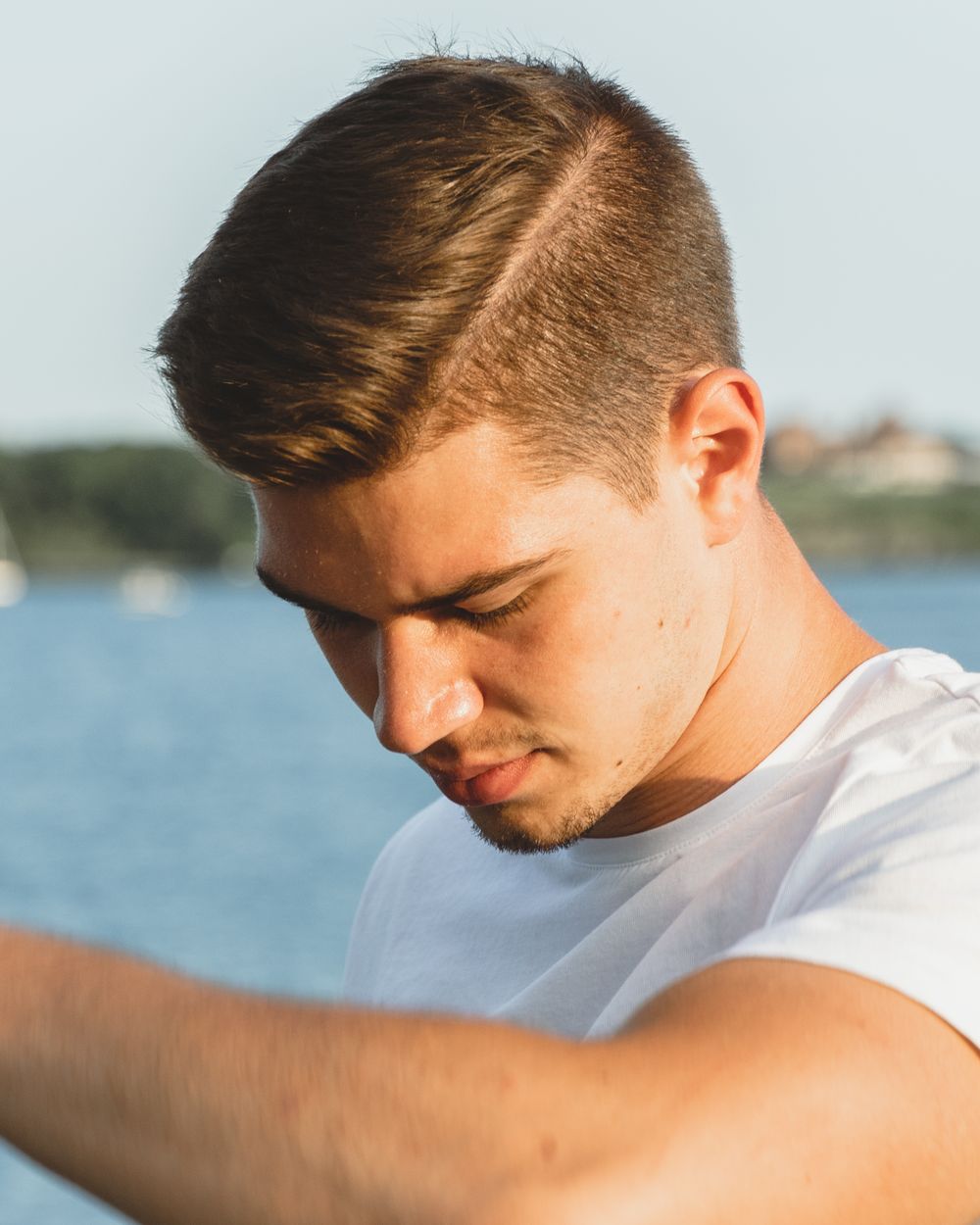 man with clean swept side hairstyle
