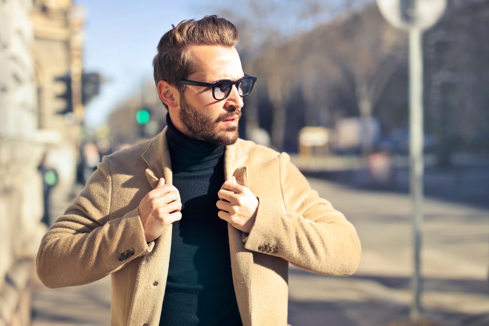 clean shaven man with slicked back hairstyle