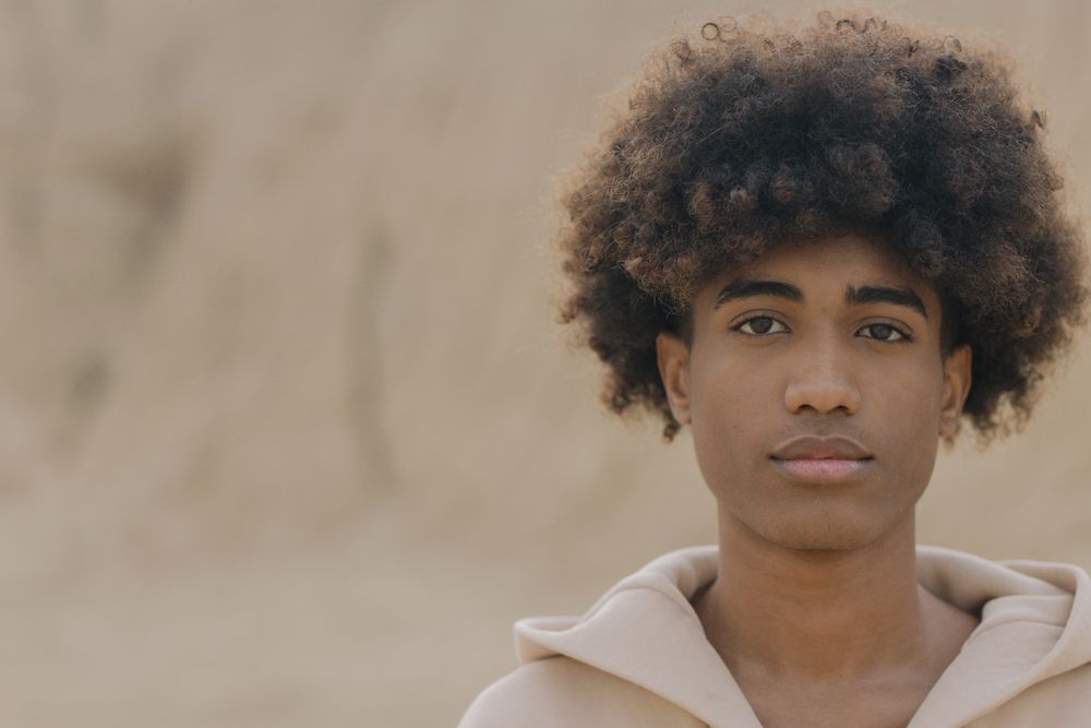 close up of man with full afro volume hairstyle