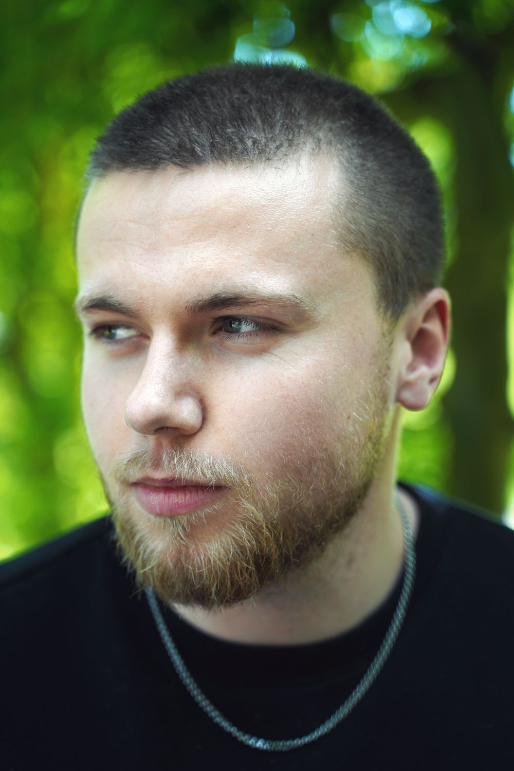 man with close cropped haircut and short beard