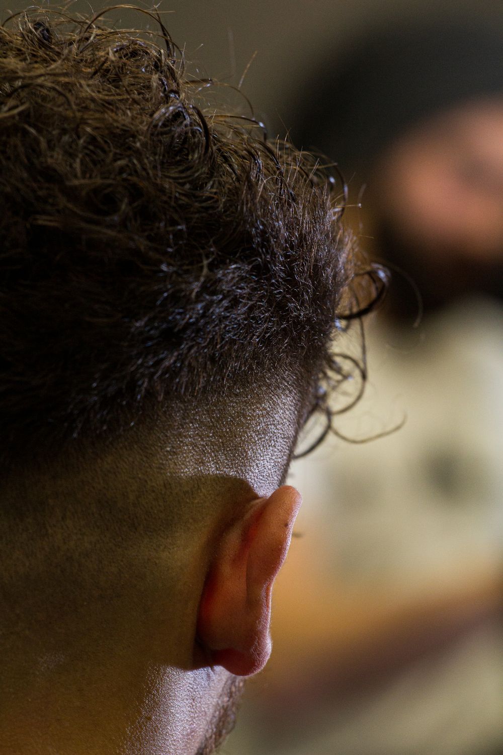 back close up of short cropped hairstyle and neckline