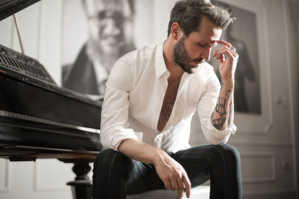 man with medium wavy hair and beard