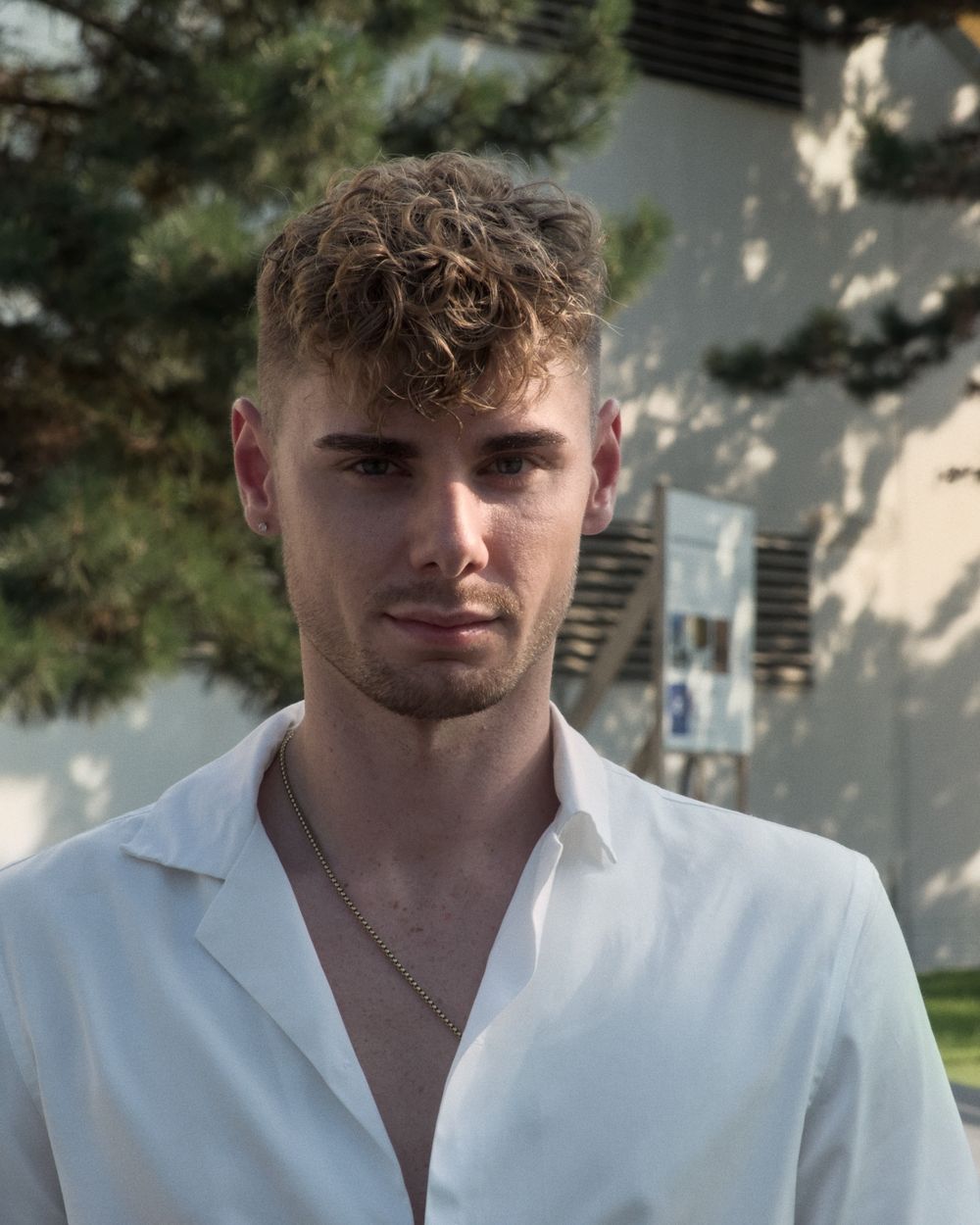 man with a short curly fringe and natural textured top