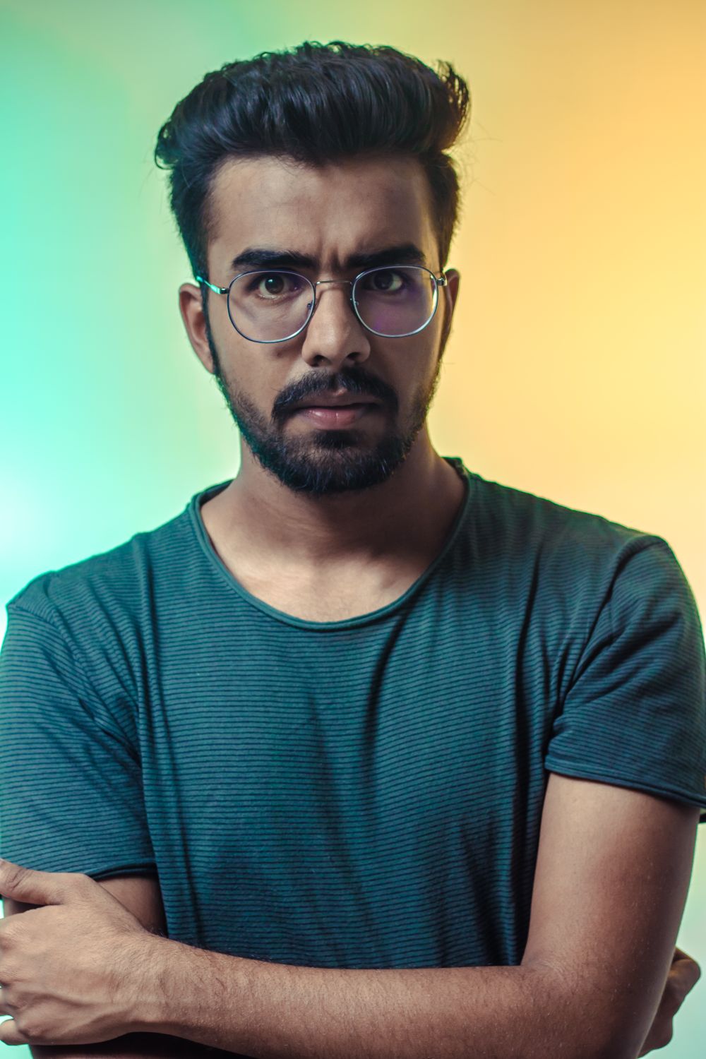 man with curly top hairstyle and beard
