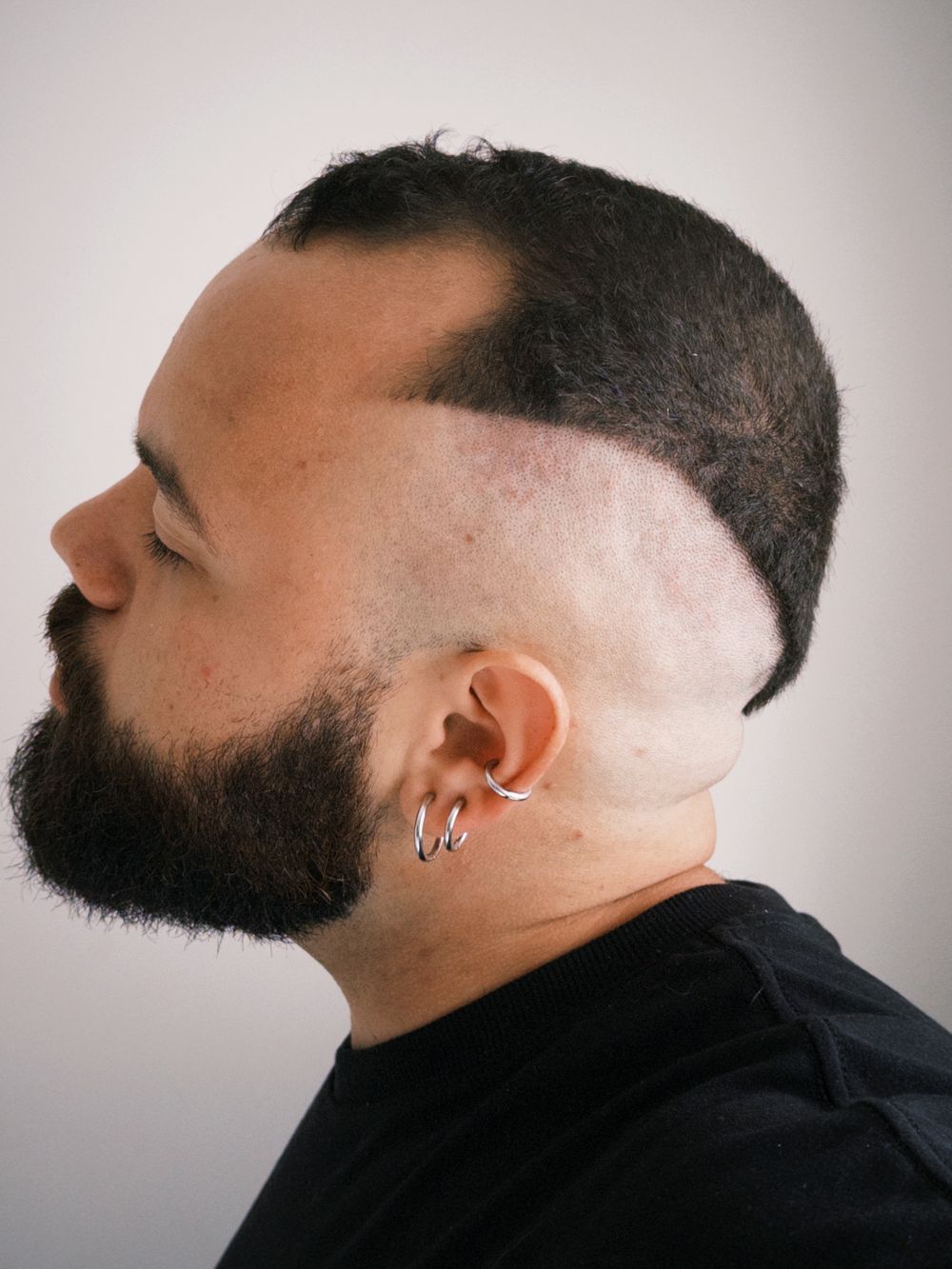 side profile of man with disconnected cropped haircut