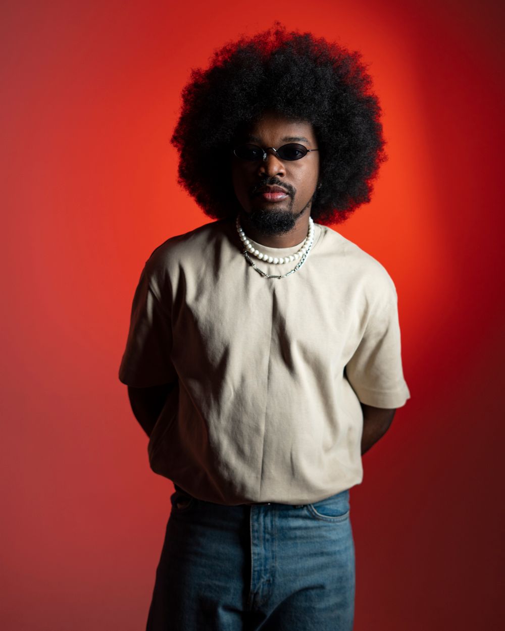 man with full afro hairstyle and rounded volume