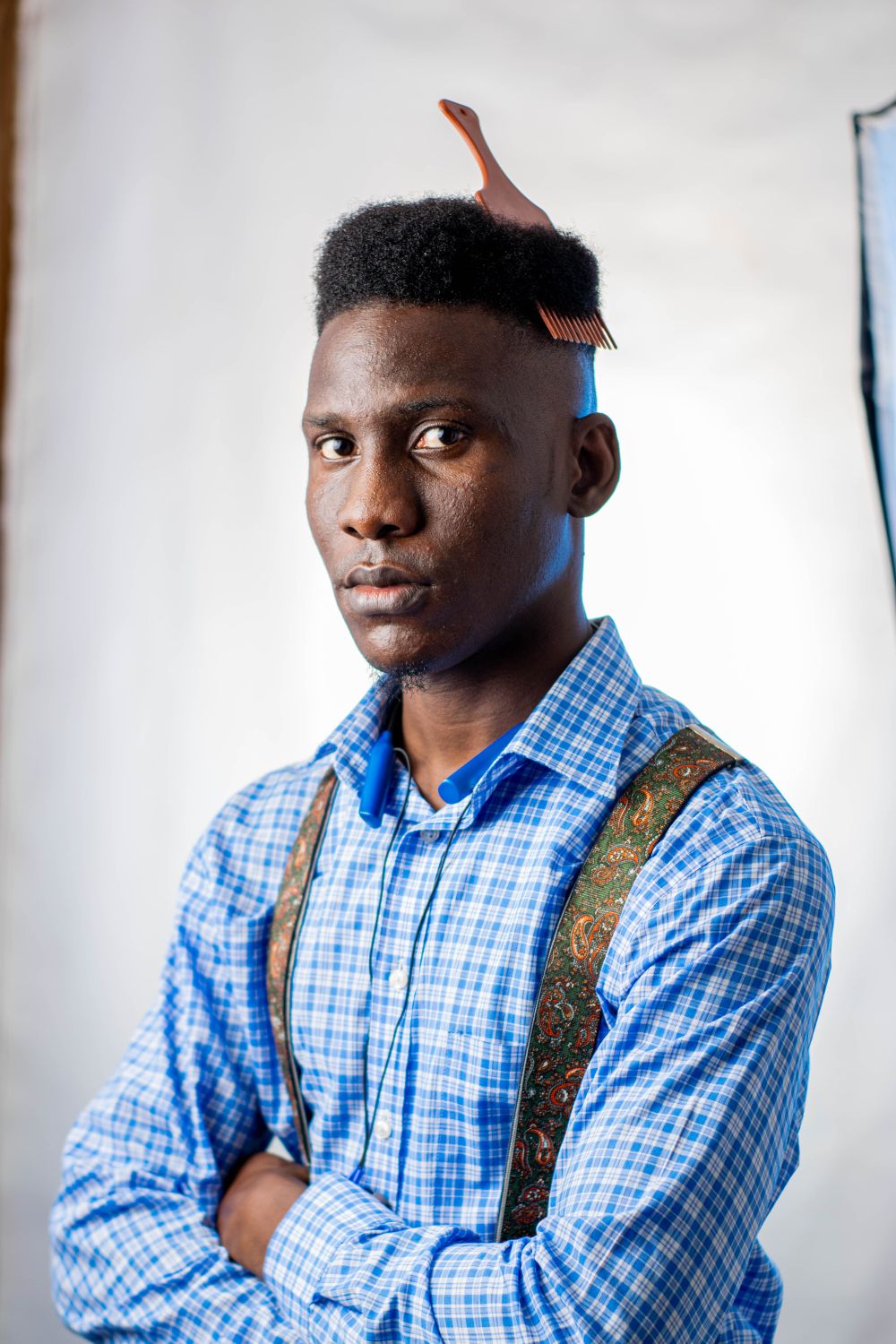man with a high top afro haircut and tapered sides