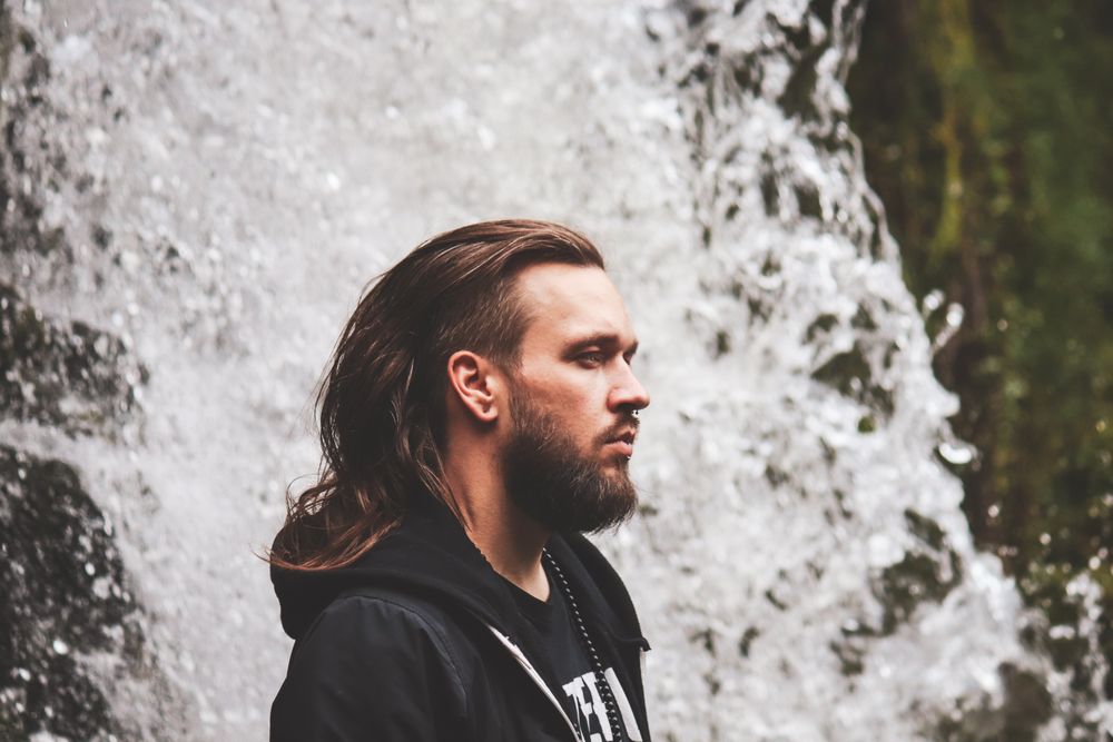 man with long wavy hairstyle and beard