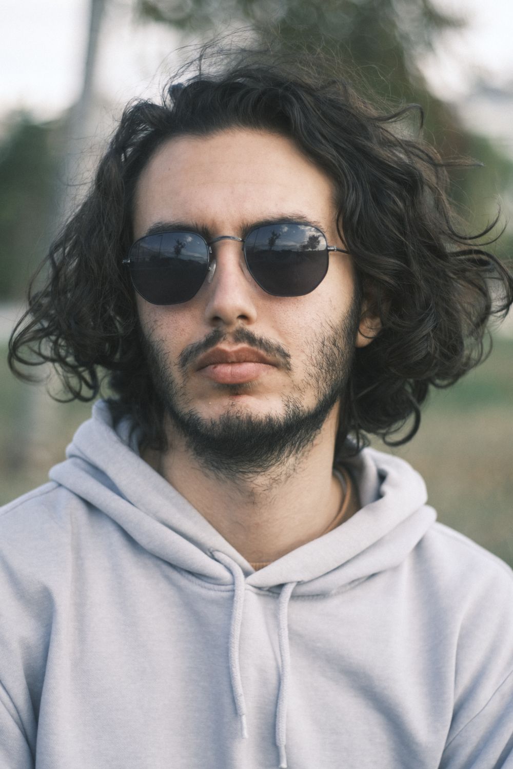 man with long wavy hair and layered natural texture