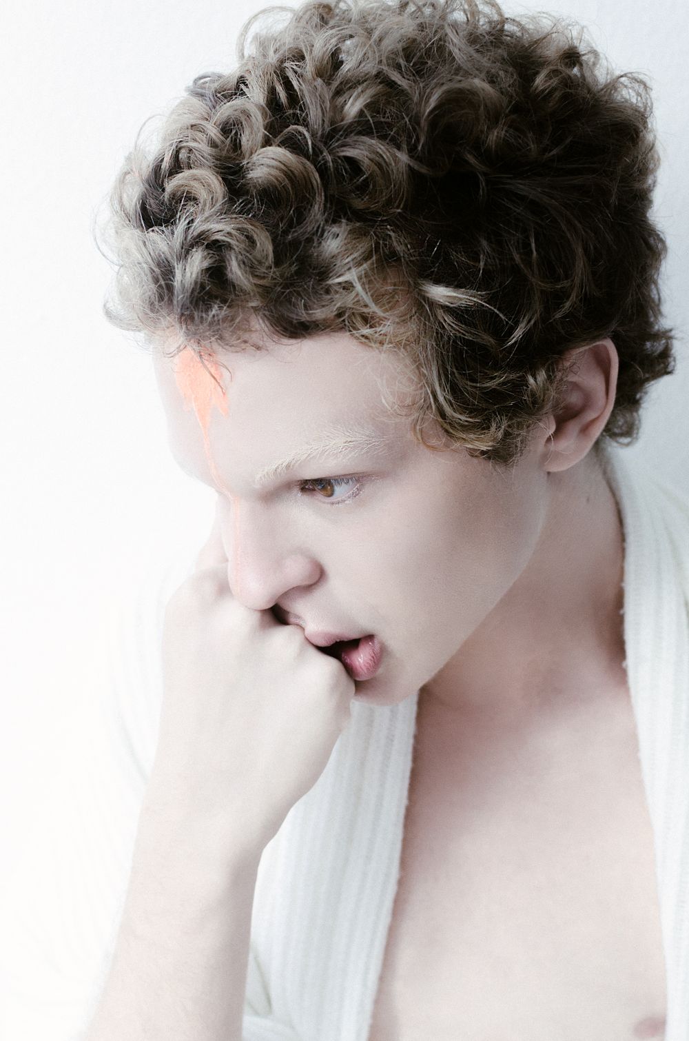 man with loose medium curls and natural hairstyle