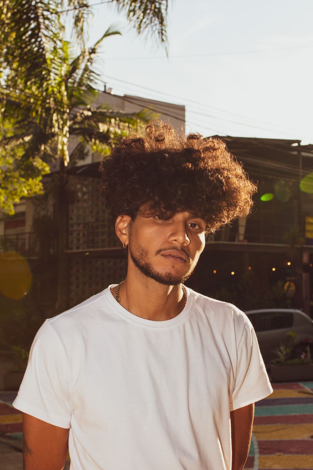 man with loose curly hair and short beard