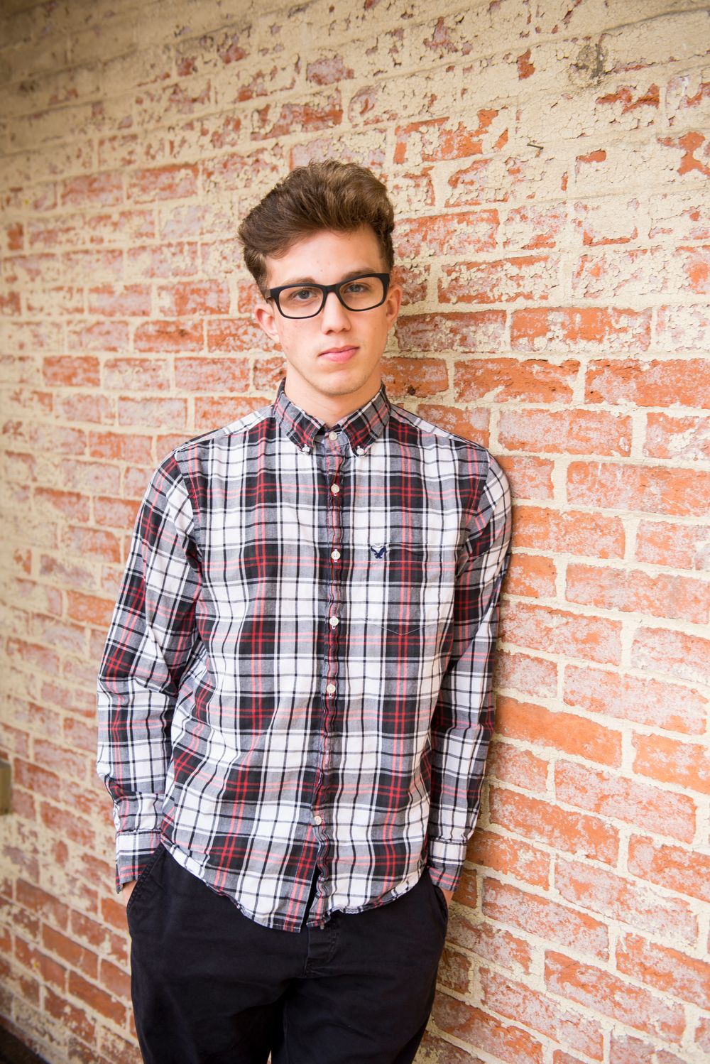 man with neat low fade side part hairstyle