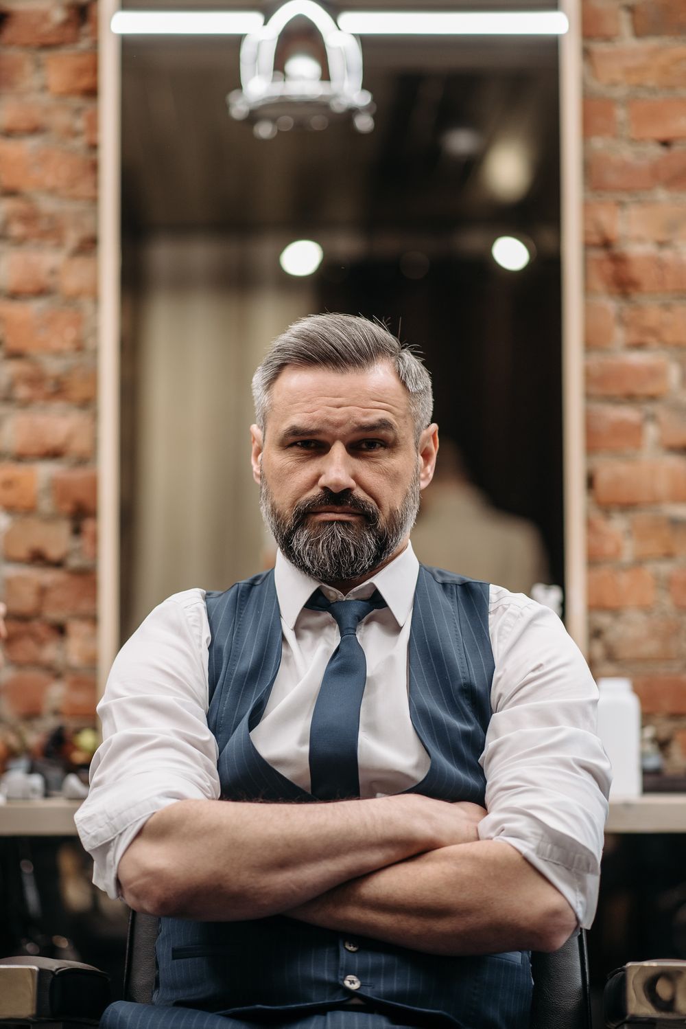 mature bearded man with a polished side part hairstyle