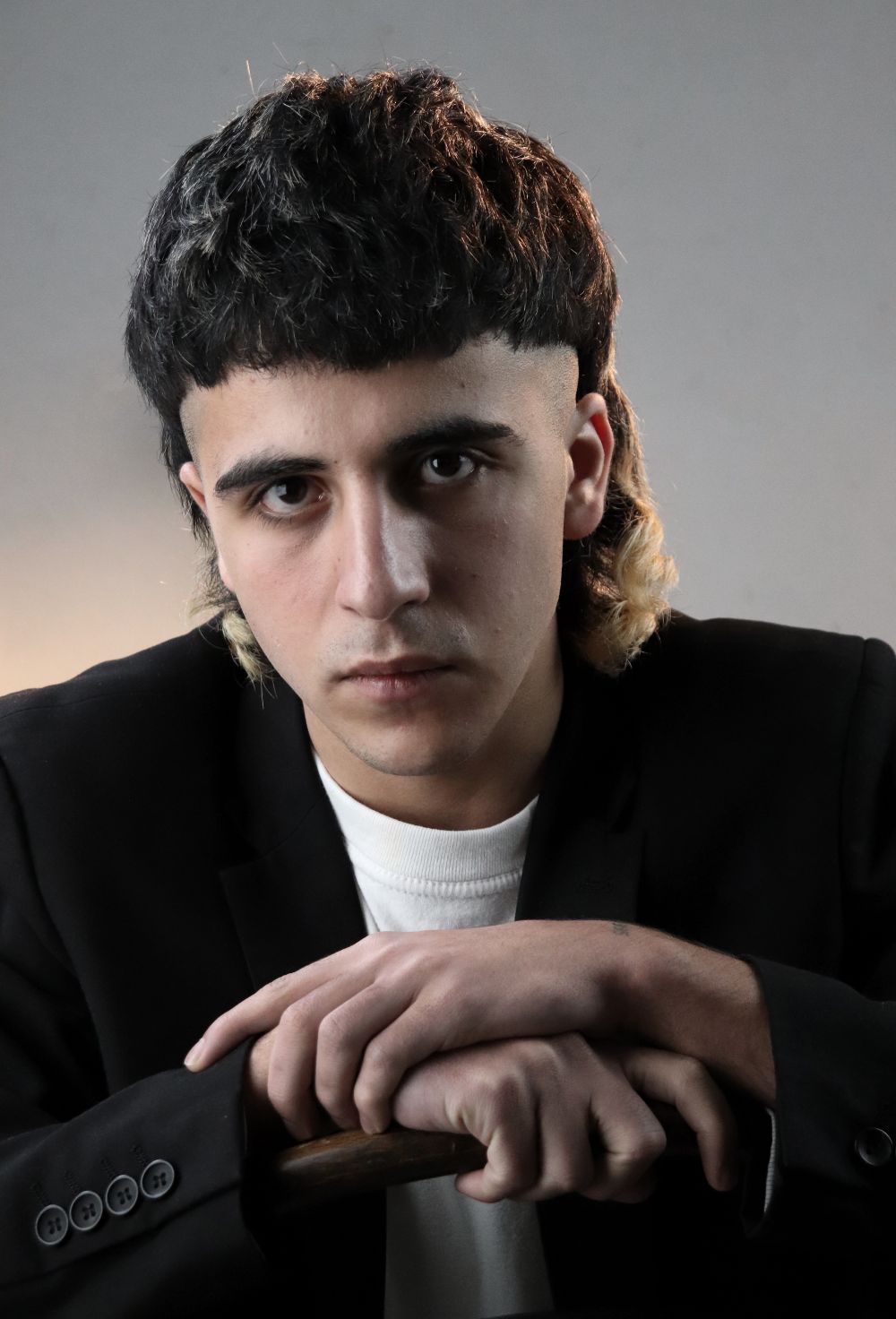 man with short modern mullet haircut and textured fringe