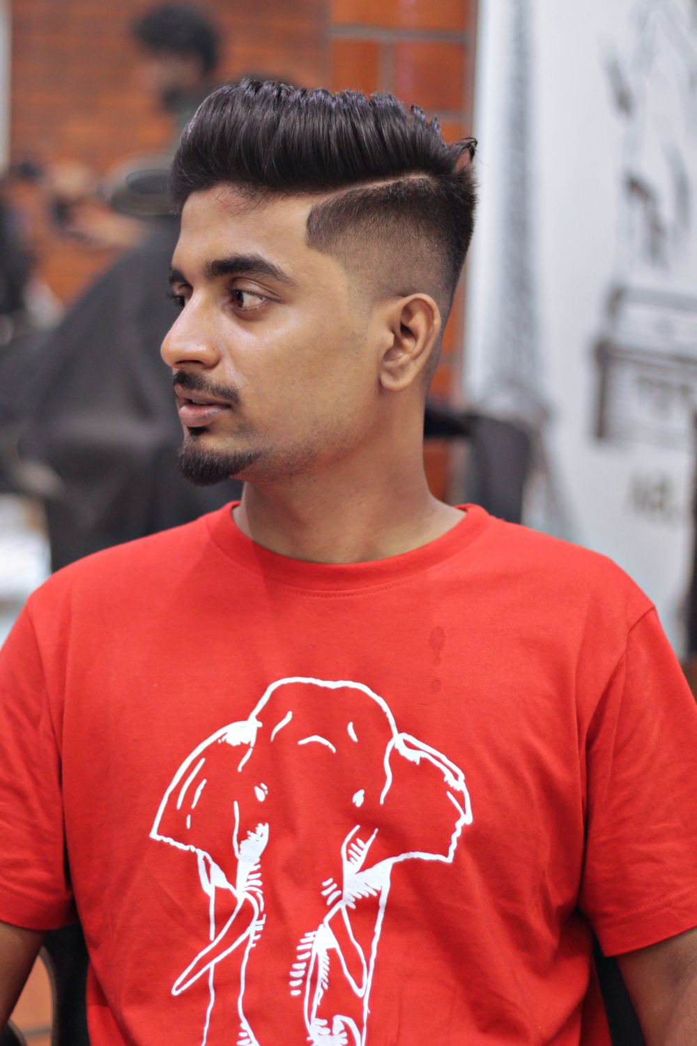 man with a short textured quiff and faded sides