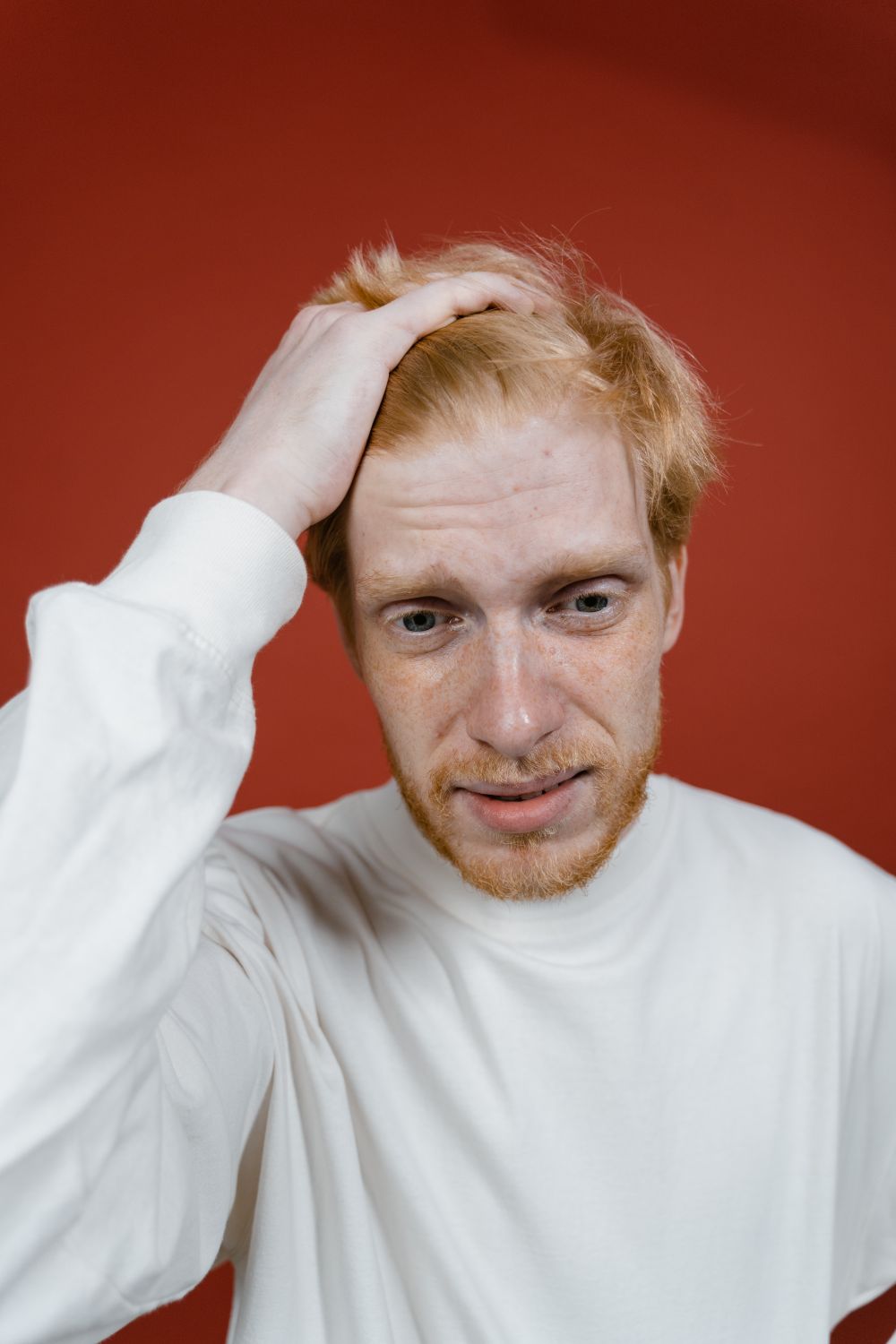 man with short natural crop and receding hairline