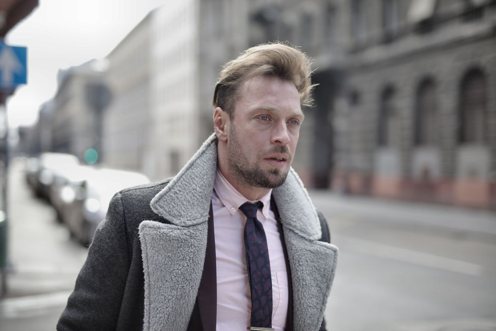 man with a natural side swept haircut and receding hairline