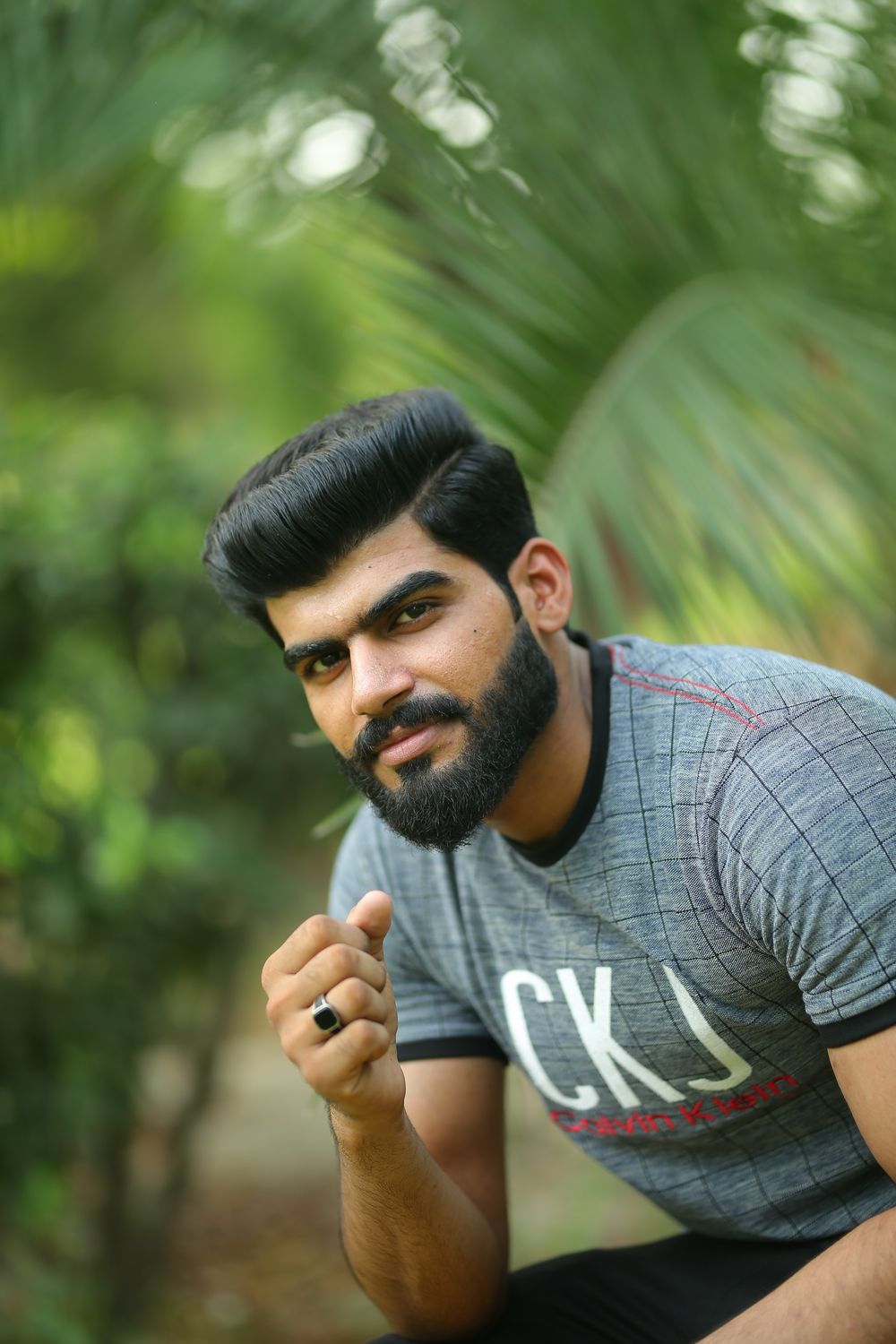 man with neat side part haircut and beard