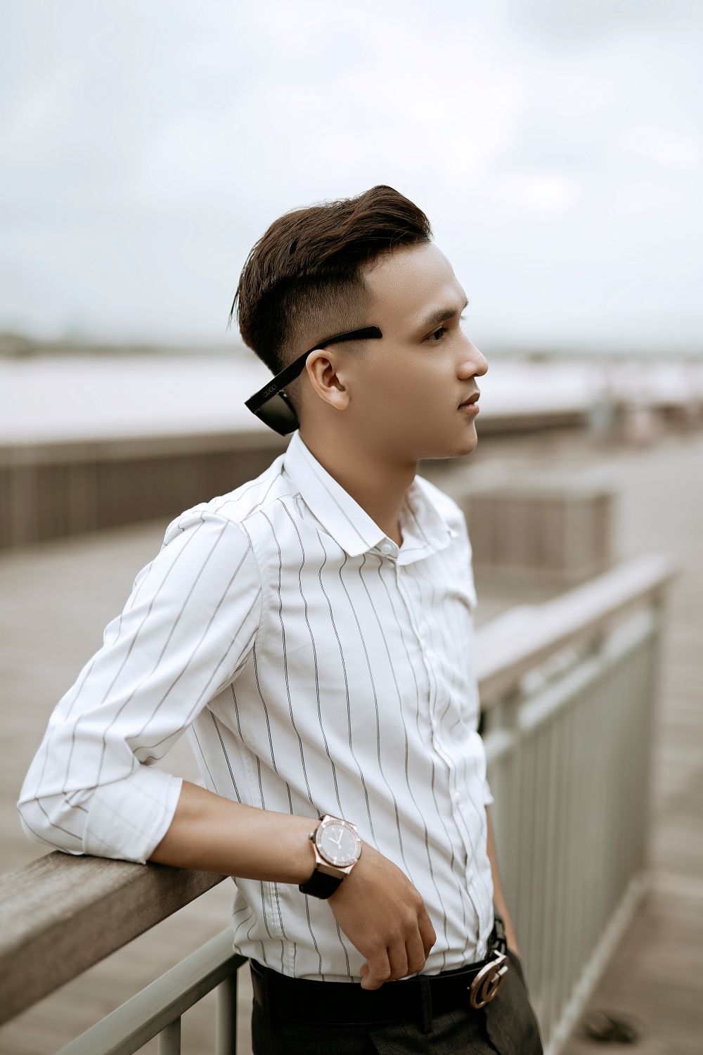 man with polished side part hairstyle and tapered sides