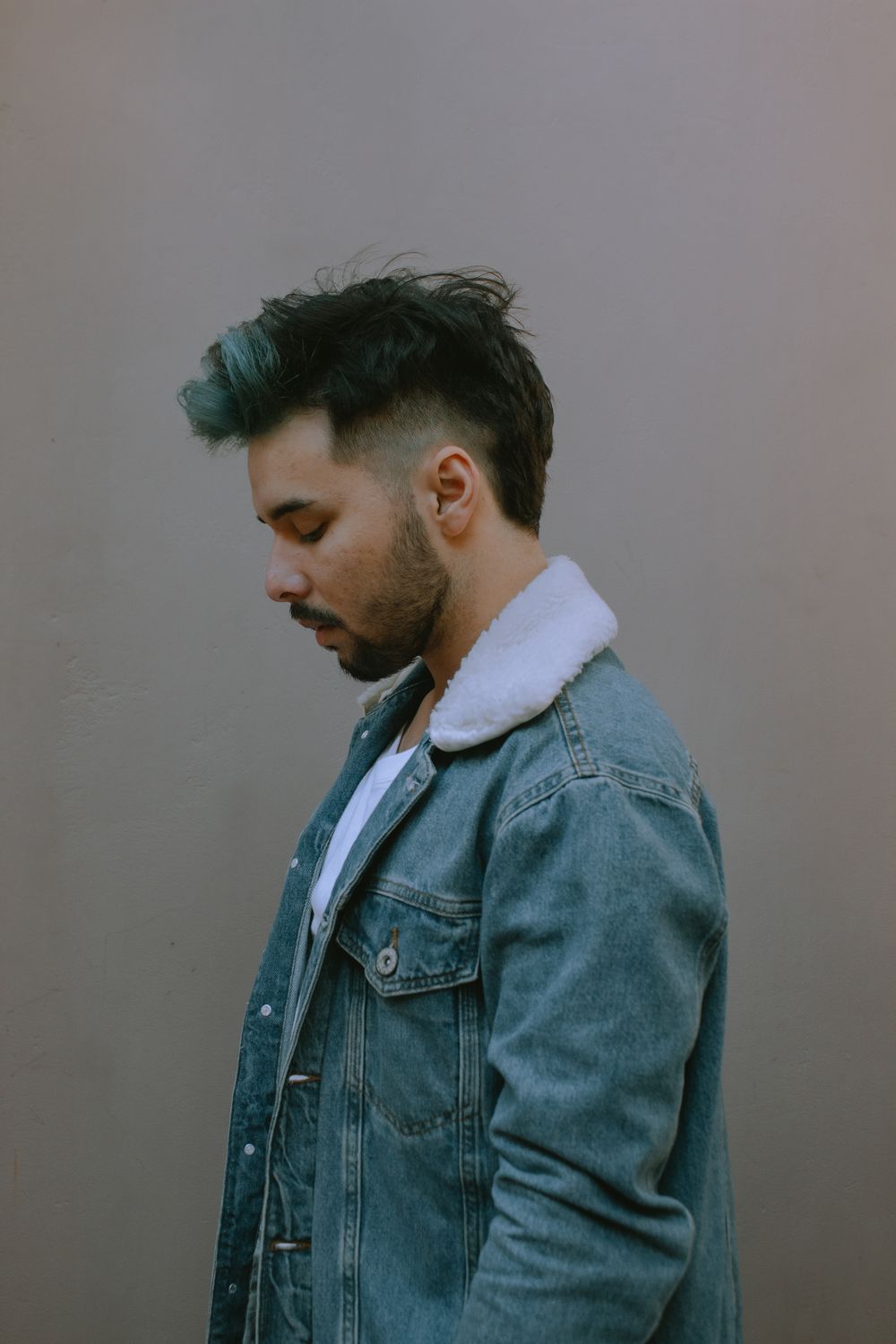 man with relaxed side part hairstyle and textured top