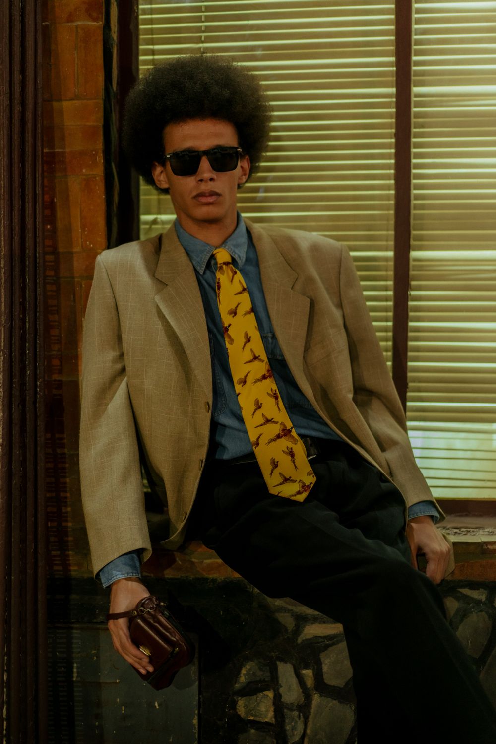 young man in suit with retro afro hairstyle