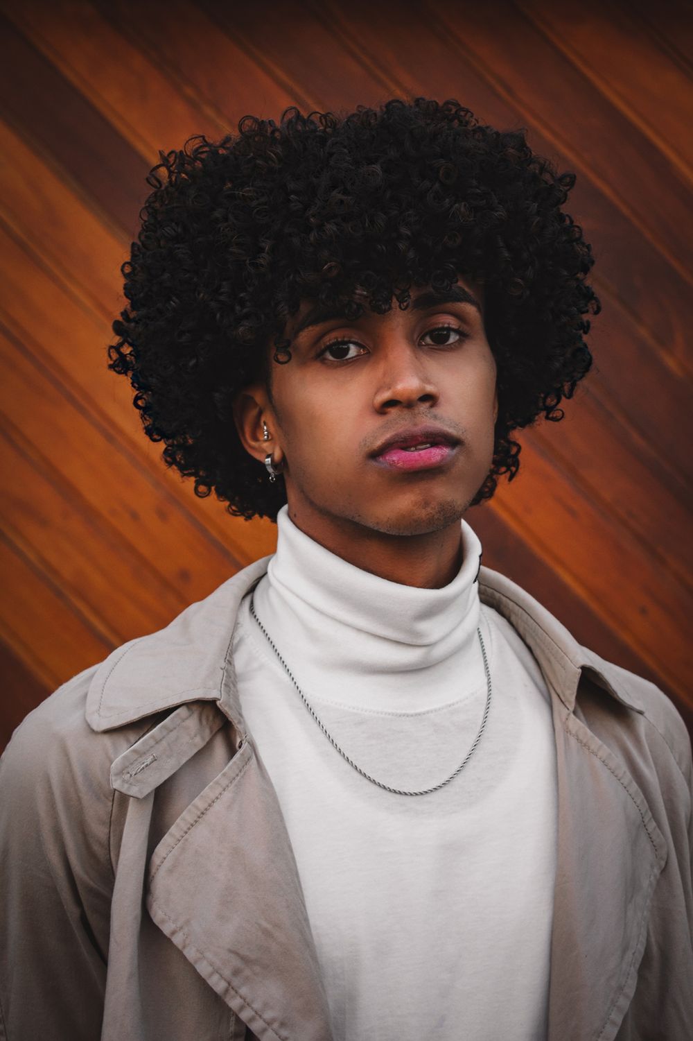 man with rounded natural curls and medium volume