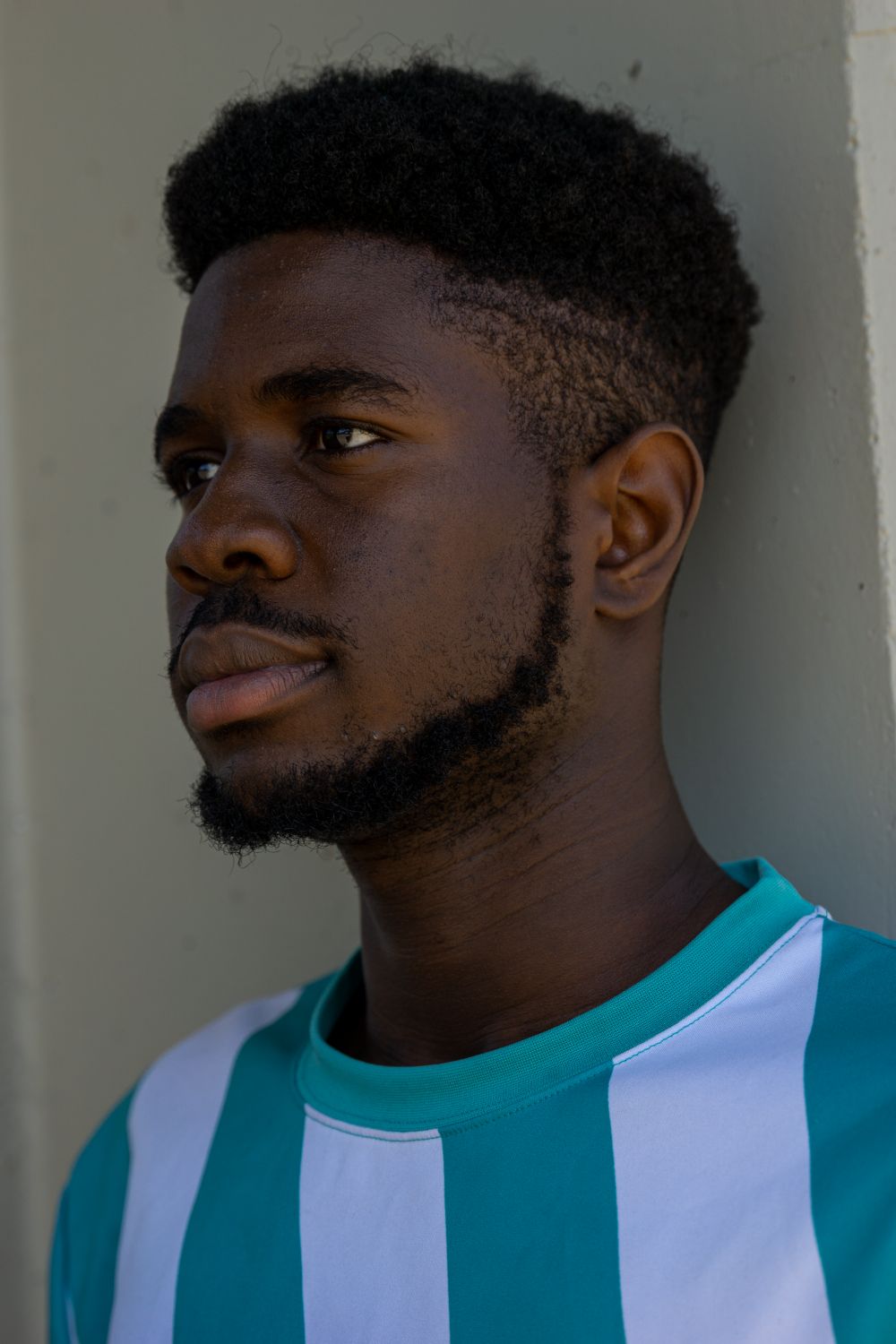 man with short afro taper and trimmed beard