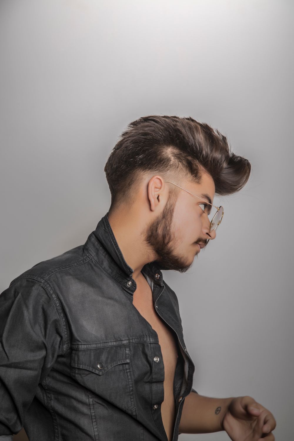 man with short textured side part hairstyle
