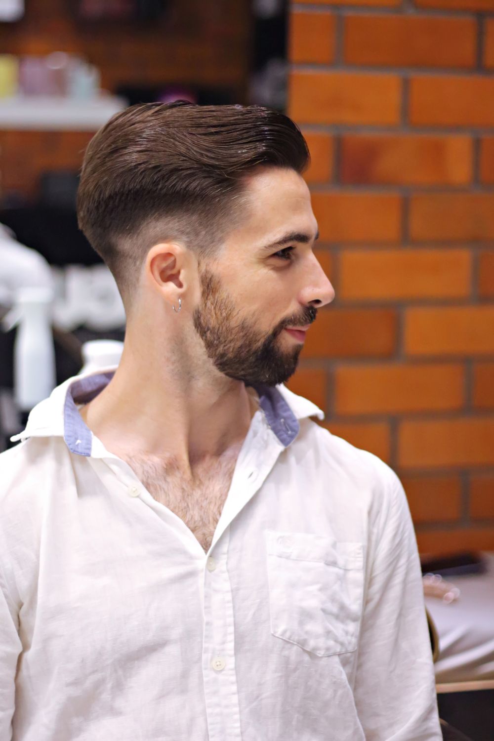 bearded man with short hair and clean taper fade