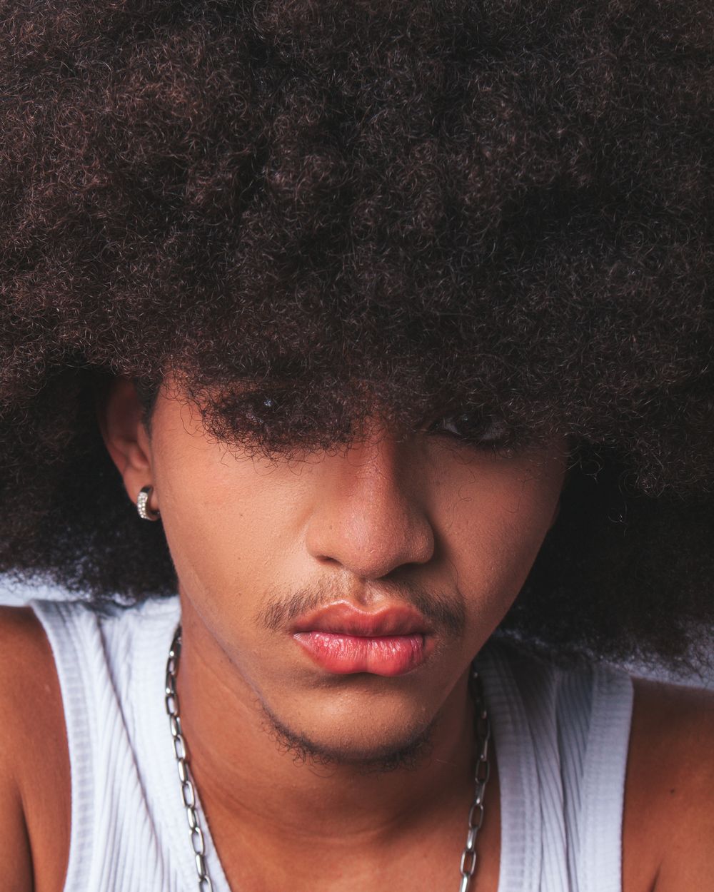 man with soft afro fringe and rounded natural volume