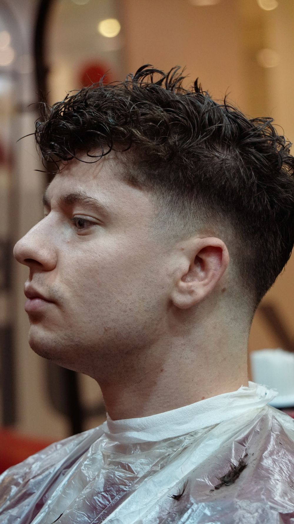 man with soft low fade and short textured crop