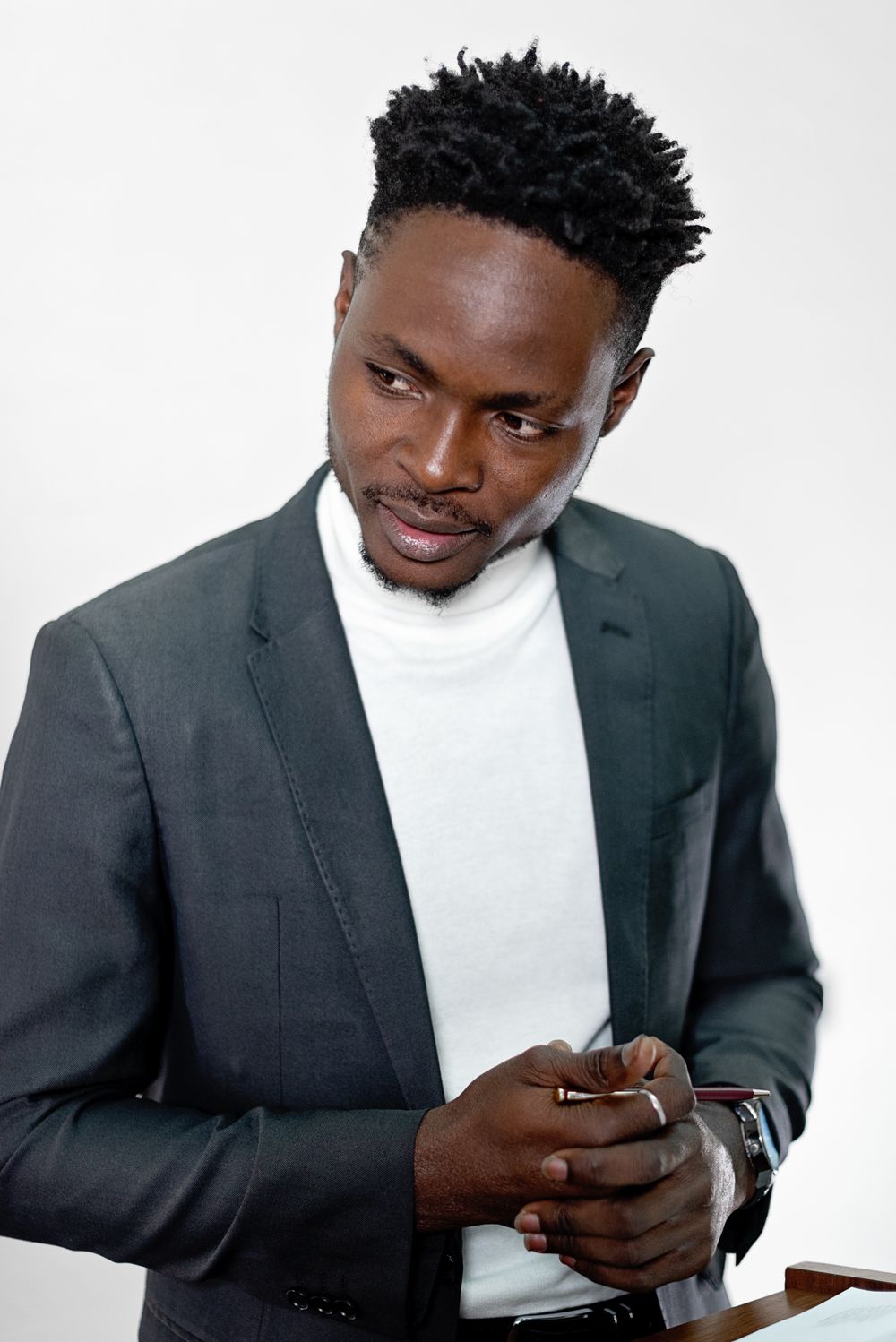 man in a suit with a short afro taper hairstyle