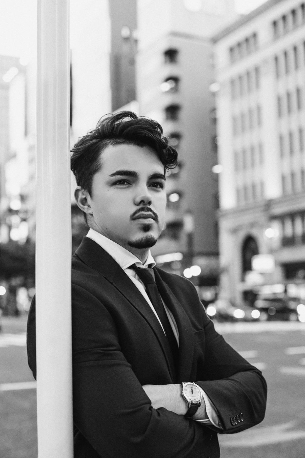 man in a suit with a short textured side swept hairstyle