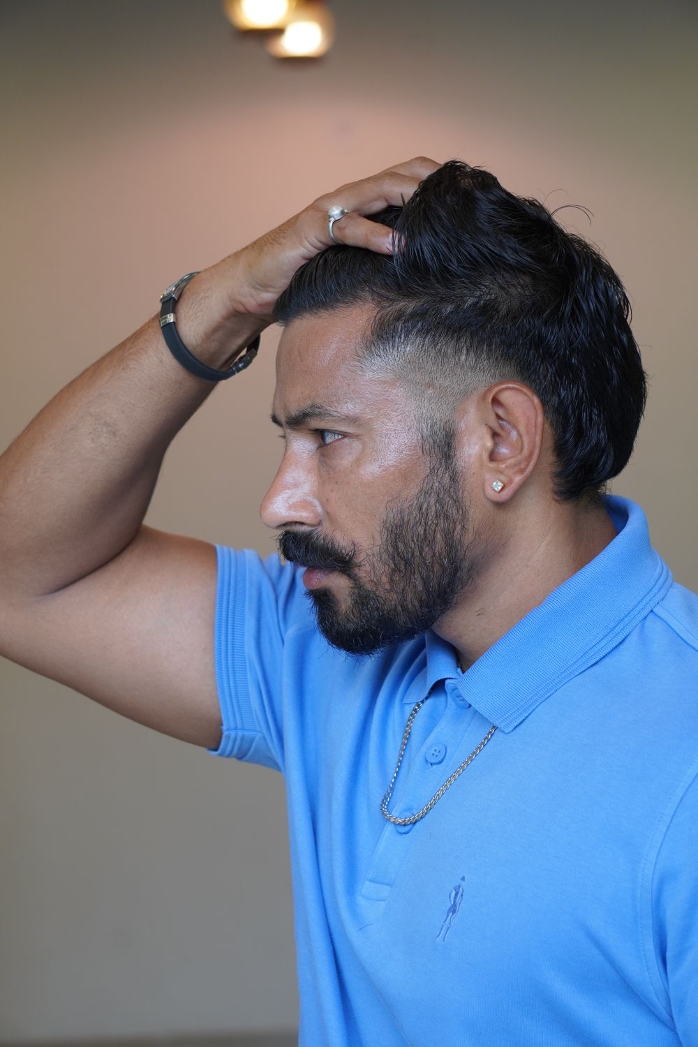 man with swept side part hairstyle and natural volume