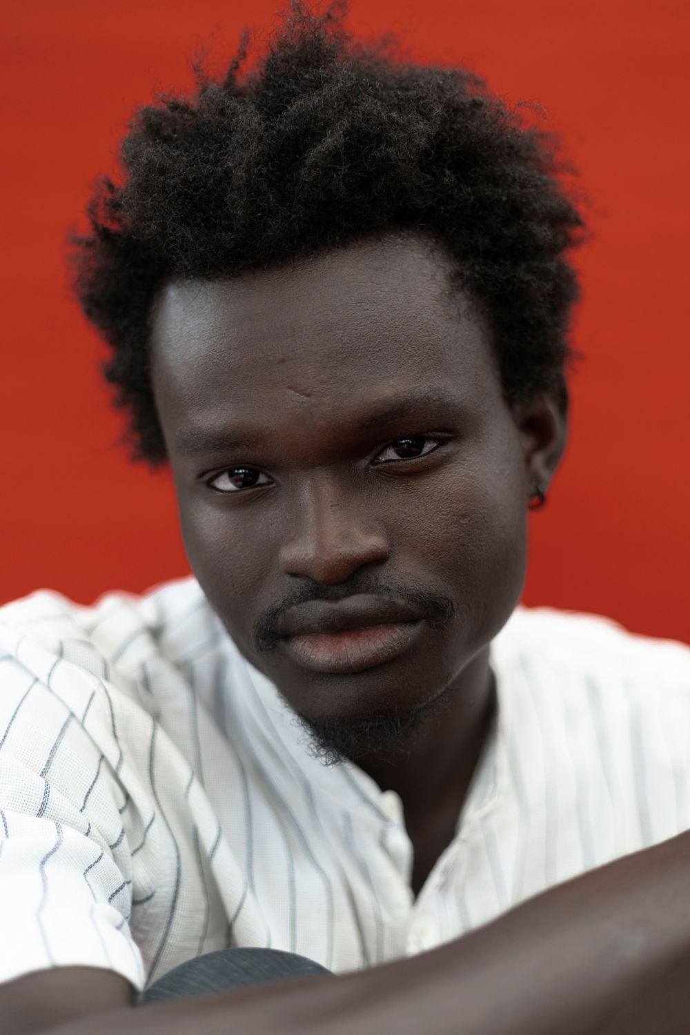 man with textured short afro top hairstyle