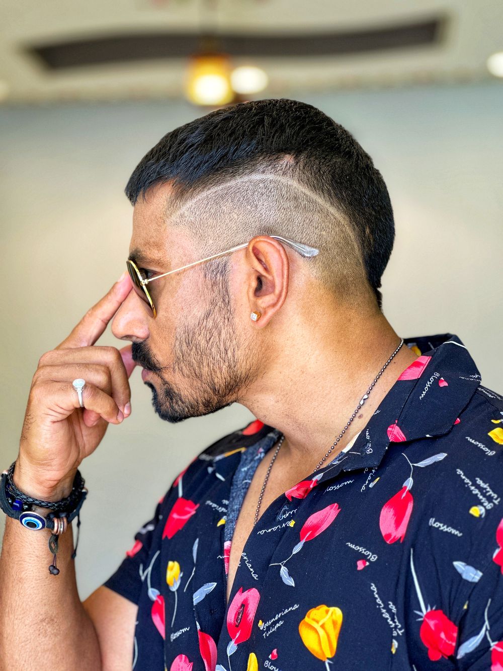 man with textured cropped haircut and sunglasses