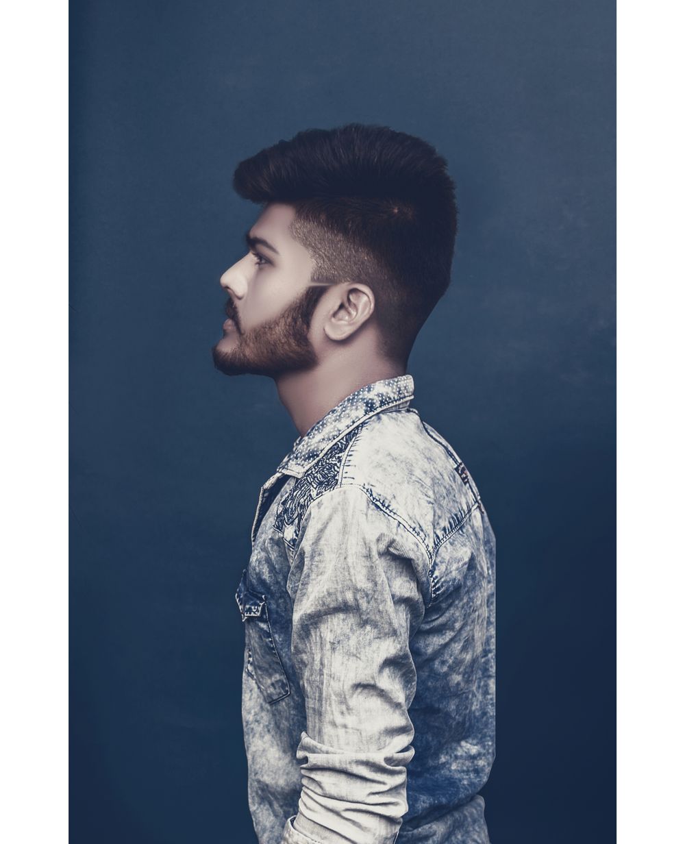 side view of young man with trendy faded haircut