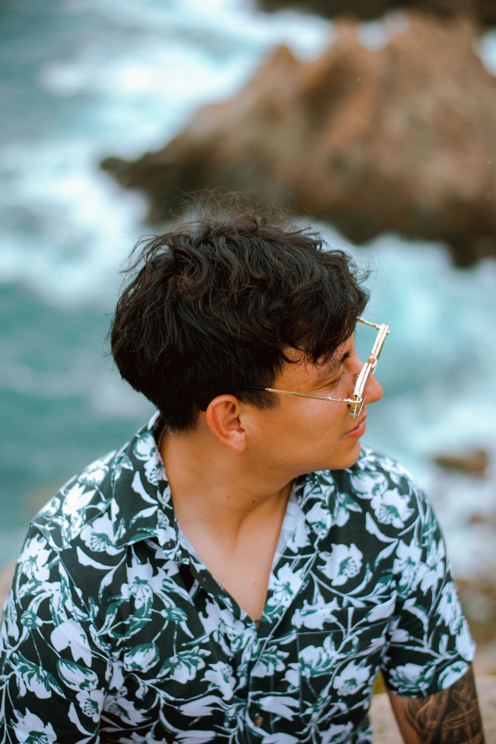 man wearing glasses with medium wavy hair