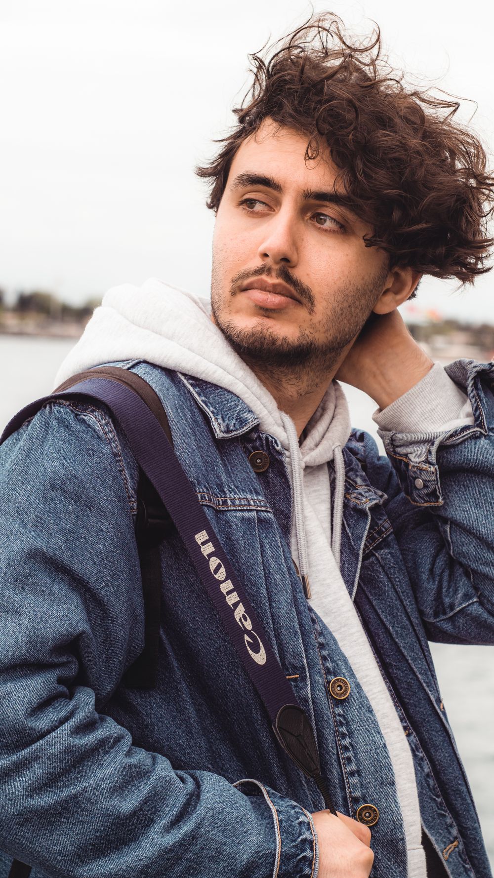 man with a wavy medium length shag haircut