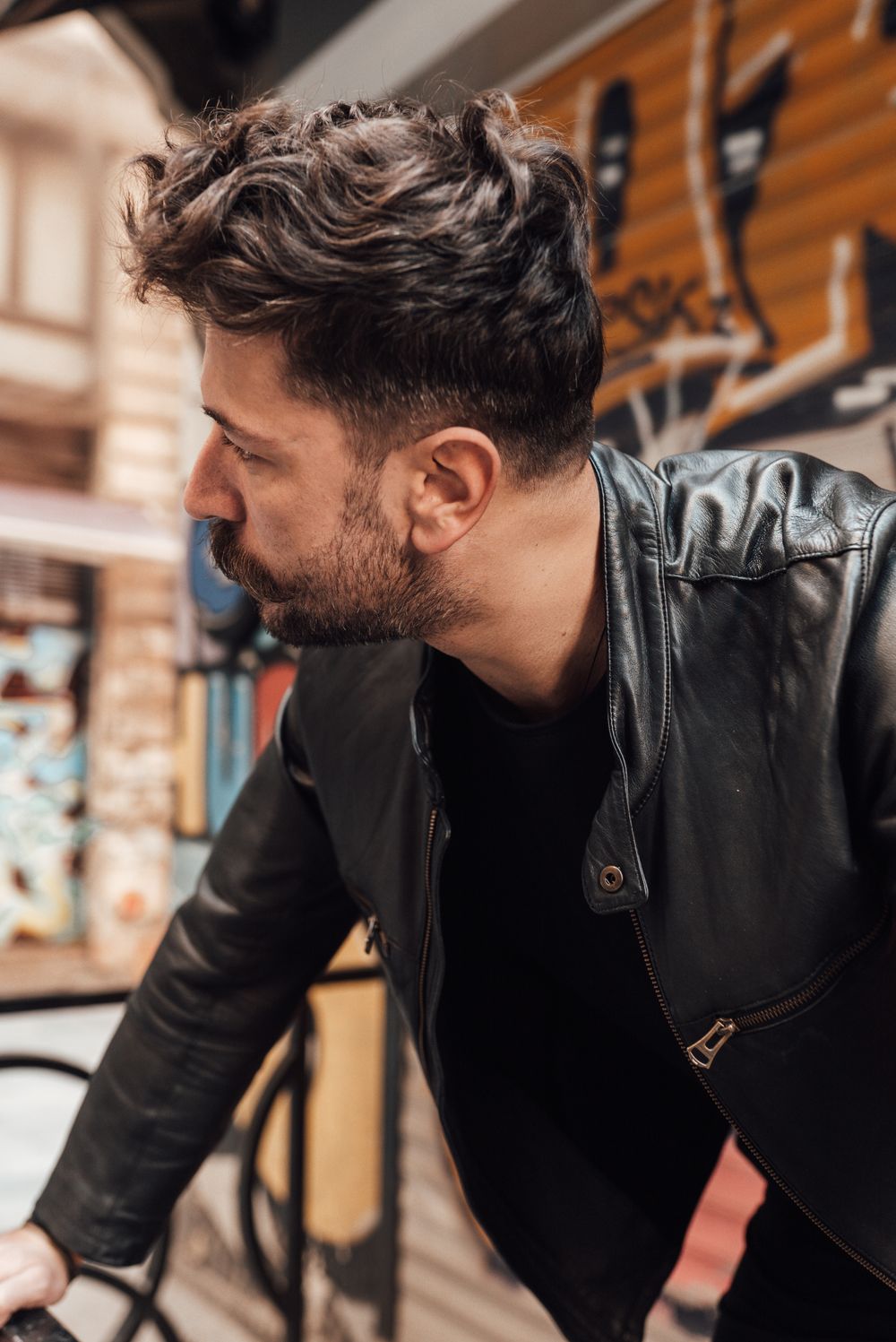 bearded man with wavy side swept hairstyle