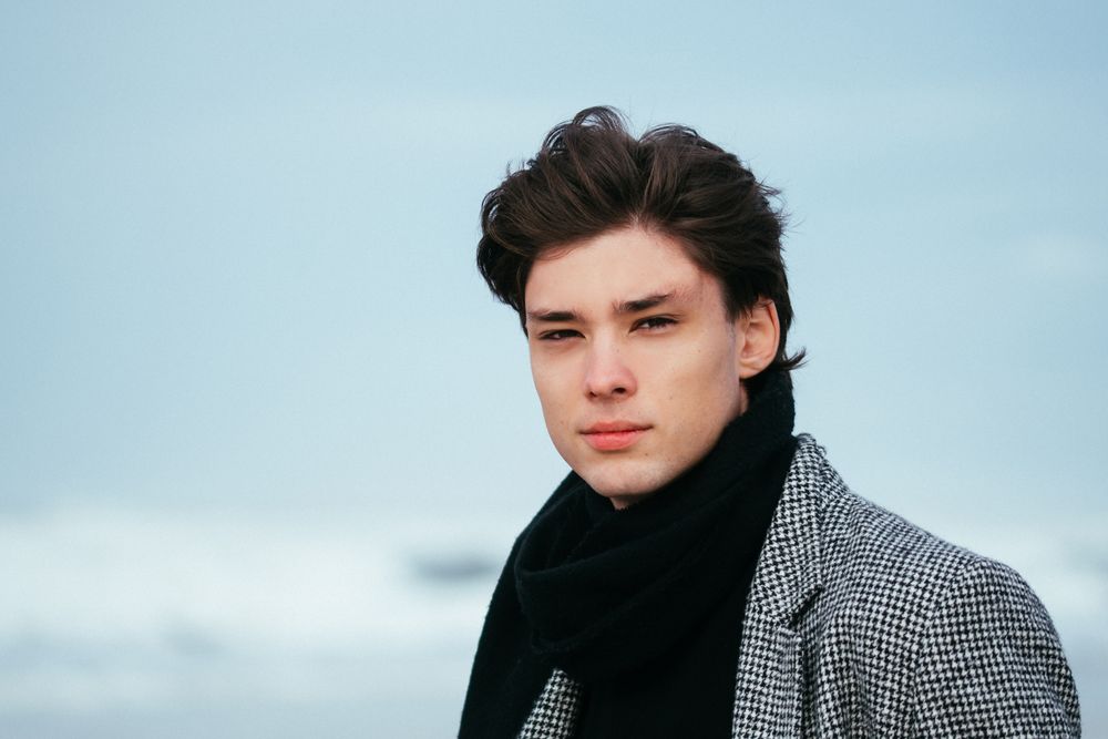 man with a medium wavy side sweep outdoors