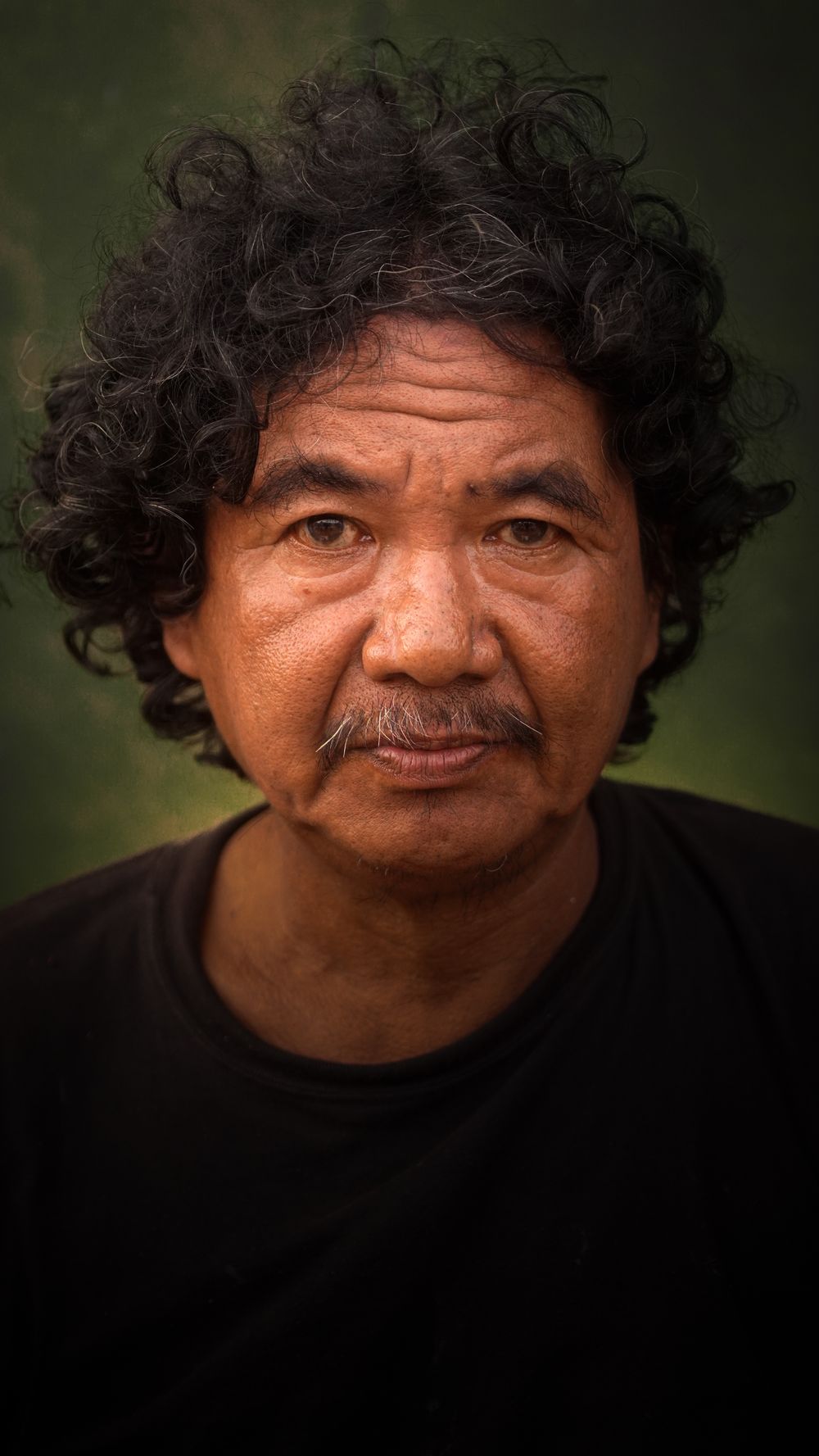mature man with medium curly hair and natural texture