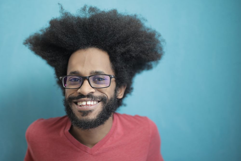 man with wide afro hairstyle and beard